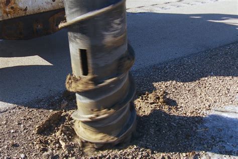 frozen ground skid steer|skid steer auger.